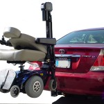 TRILIFT Classic on a class II Receiver Hitch, carrying a Pride Select on a Toyota Camry.